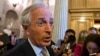 Sen. Bob Corker speaks with reporters after the immigration bill got more than 60 needed votes to advance in the Senate, at the Capitol in Washington, June 24, 2013. 