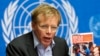 FILE - World Health Organization Assistant Director General Bruce Aylward holds a report during a news conference on Ebola at the United Nations in Geneva, Sept. 16, 2014.