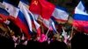 Pro-Russian people celebrate in Lenin Square, in Simferopol, Ukraine, March 16, 2014.