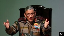 FILE - Indian Army Chief Bipin Rawat speaks during a press conference ahead of Army Day in New Delhi, India, Jan. 12, 2018.