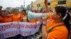 FILE: Garment workers shout during a protest calling for higher wages in Phnom Penh September 17, 2014.