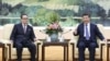 2016年6月1日中国领导人习近平（右）在北京会见朝鲜劳动党中央政治局委员李洙墉
