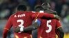 John Mensah, wa Ghana akimtia moyo mwenzake Asamoah Gyan, baada ya kushinda kupachika mkwaju wa penelti dhidi ya Uruguay.