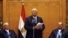Adli Mansour (C), Egypt's chief justice and head of the Supreme Constitutional Court, speaks at his swearing in ceremony as the nation's interim president in Cairo, July 4, 2013, a day after the army ousted Mohamed Morsi as head of state.