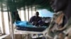 FILE - A child sick with malaria and from malnutrition lies on a bed in a hospital in Bor, South Sudan, March 15, 2014.
