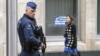 A Belgian police officer secures the area around the European Council headquarters following recent bomb attacks in the Brussels metro and at Belgian international airport of Zaventem, in Brussels, Belgium, March 30, 2016.