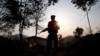 FILE- A Kachin Independence Army rebel stands at an outpost in Lawa Yang, Myanmar, March 20, 2018. Witnesses reported on Nov. 26, 2024, that the KIA took control of a key trading town on the Chinese border and a rare earth mining hub.