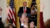 FILE - President Donald Trump looks at reporters during a news conference in the East Room of the White House in Washington, Feb. 16, 2017. 