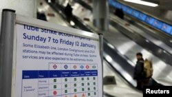 A notice about the impacts of a strike is placed at King's Cross station, as London Underground workers strike over pay and terms, in London, Britain, Jan. 7, 2024