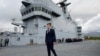 FILE PHOTO: French President Emmanuel Macron walks on the deck of the amphibious helicopter carrier Dixmude docked in the French Navy base of Toulon, France, Nov. 9, 2022. 