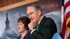 Sen. Tom Harkin, right, stands with Sen. Susan Collins just after the Senate cleared a major hurdle and agreed to proceed to debate a bill that would prohibit workplace discrimination against gay, bisexual and transgender Americans, at the Capitol in Washington, Nov. 4, 2013. 