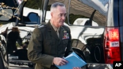 FILE - Chairman of the Joint Chiefs of Staff, Gen. Joseph Dunford, leaves a meeting at the White House, April 12, 2018, in Washington.