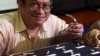 Filipino archeologist Armand Salvador Mijares shows bones and teeth they recovered from Callao Cave belonging to a new specie they called Homo luzonensis during a press conference in metropolitan Manila, Philippines on Thursday, April 11, 2019. (AP Photo/