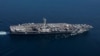 The Nimitz-class aircraft carrier USS Abraham Lincoln transits the Strait of Gibraltar, entering the Mediterranean Sea as it continues operations in the 6th Fleet area of responsibility, April 13, 2019.