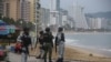 Members of the federal forces keep watch at a beach as Hurricane Otis barrels towards Acapulco, Mexico, Oct. 24, 2023.