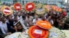 Local residents pay their respects to the victims of the attack at the Holey Artisan Bakery at a stadium in Dhaka, Bangladesh, July 4, 2016. 