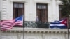 FILE - U.S. and Cuban flags hang side by side at the U.S pavilion during the Havana International Fair (FIHAV) in Cuba, Nov. 2, 2015. 