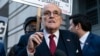 FILE - Rudy Giuliani speaks during a news conference outside federal court in Washington, Dec. 15, 2023.