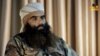 An image grab taken from an undated video released via al Nusra's official channel Al-Manara Al-Baydaa shows Abu Firas al-Suri, the spokesman for al-Qaida's Syrian affiliate, al Nusra Front, giving an interview at an undisclosed location.