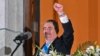 Guatemala's new President Bernardo Arevalo gestures at supporters from a balcony of the Miguel Angel Asturias Cultural Centre in Guatemala City, after the inauguration ceremony, early on Jan. 15, 2024.