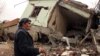 A resident walks on the rubble of a destroyed house in the mostly Kurdish town of Silopi, Turkey, Jan. 19, 2016. Turkey's president has ruled out any further peace efforts with Kurdish rebels.