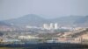 FILE PHOTO: Kaesong city is seen behind the inter-Korean Kaesong Industrial Complex, across the DMZ separating North Korea from South Korea in this picture taken from Dora observatory in Paju