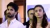 Bollywood film "Udta Punjab," or "Flying Punjab" actors Shahid Kapoor, left, and Alia Bhatt listen to a question during a press conference, in Mumbai, India, Wednesday, June 8, 2016.