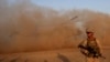 FILE - A U.S. Marine takes part during a training session for Afghan army commandos in Shorab military camp in Helmand province, Afghanistan, Aug. 27, 2017.