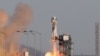 FILE - A Blue Origin New Shepard rocket lifts off from Launch Site One in west Texas, Dec. 11, 2021. 