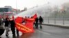 FILE - Protesters run from water cannons used by riot police to disperse a rally in Istanbul March 11, 2015.