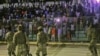 FILE - Somali security forces patrol during a soccer match at Konis Stadium, in Modadishu, Somalia, Sept. 8, 2017. 