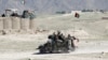 FILE - Afghan special forces patrol in Pandola village near the site of a U.S. bombing in the Achin district of Nangarhar province in eastern Afghanistan, April 14, 2017.