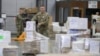 FILE - An Indiana National Guardsman lines up pallets of medical supplies in Indianapolis, March 26, 2020.