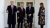 President Donald Trump, Vice President Mike Pence and first lady Melania Trump, present Conan, the military working dog injured in the successful operation targeting IS leader Abu Bakr al-Baghdadi, in the Rose Garden, Nov. 25, 2019, in Washington.