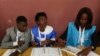 Voting officials are seen at their stations during a presidential election in Luanda, Angola, Aug. 23, 2017.