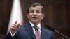 Turkish Prime Minister Ahmet Davutoglu addresses his lawmakers at the parliament in Ankara, Jan. 26, 2016. Davutoglu reiterated Turkey's opposition to including Syrian Kurdish forces at the Geneva talks. 