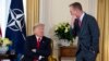 White House chief of staff Mick Mulvaney talks with US President Donald after his meeting with NATO Secretary General Jens Stoltenberg at Winfield House, Dec. 3, 2019, in London. 