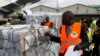 Independent Electoral and Boundaries Commission IEBC officials receive ballot papers for the repeat of the presidential election on Oct. 26, at JKIA airport in Nairobi, Kenya, Oct. 23, 2017.