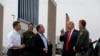 President Donald Trump reviews border wall prototypes, March 13, 2018, in San Diego.