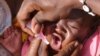 FILE - A Sudanese child is immunized against measles in North Darfur, Sudan.