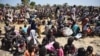 FILE - A photo of some of the thousands of people who flocked into Leer town, South Sudan, to receive food from the International Committee of the Red Cross, Dec. 15, 2015. 