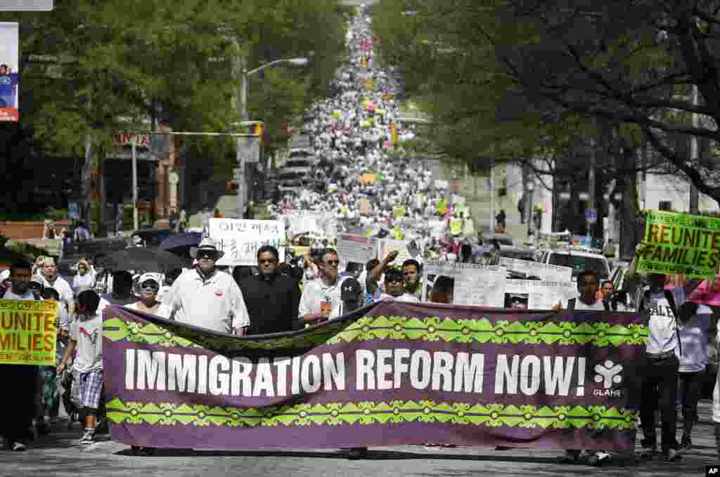 Protesters for immigration reform march near the Georgia Capitol in Atlanta, April 10, 2013.