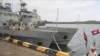 FILE - Cambodian navy crew members stand on a patrol boat at the Ream Naval Base in Sihanoukville, Cambodia, July 26, 2019. The U.S. Treasury Department on Nov. 10, 2021, imposed sanctions on two senior Cambodian defense officials over allegations of graf