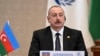 FILE - In this photo released by Uzbekistan's President Press Office, Azerbaijan's President Ilham Aliyev attends the Summit of the Economic Cooperation Organisation in Tashkent, Uzbekistan, on Nov. 9, 2023. 