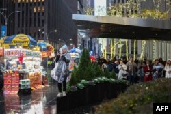 People watch the annual Macy's Thanksgiving Day Parade in New York on Nov. 28, 2024.