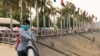 Girls wear masks in the park in front of the Royal Palace in Phnom Penh, Cambodia on 11th February, 2020. (Malis Tum/VOA Khmer)