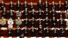 Delegates applaud as Chinese President Xi Jinping arrives for the opening session of China's National People's Congress (NPC) at the Great Hall of the People in Beijing, Friday, May 22, 2020. (AP Photo/Ng Han Guan, Pool)