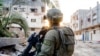 Израильский солдат во время боевого патрулирования в Секторе Газа. Июль 2024г. (Photo by Israeli Army / AFP)