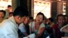 A government health worker takes a blood sample from a woman to be tested for malaria in Ta Gay Laung village hall in Hpa-An district in Kayin state, southeastern Myanmar, Nov. 28, 2014.