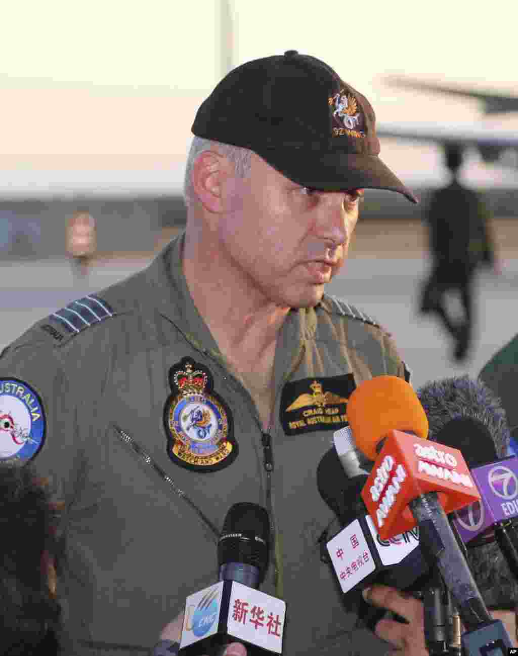 Royal Australian Air Force commander Craig Heap speaks to the media after Japan Maritime Self-Defense Force's P-3C Orion arrived to help with search operations for the missing Malaysia Airlines plane, at Pearce Base in Perth, Australia, March 23, 2014.